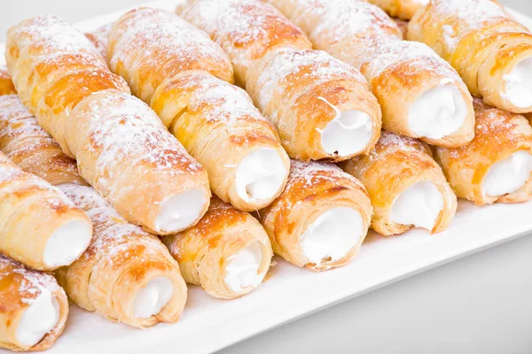 Tube of pastry filled with snow — Stock Photo, Image