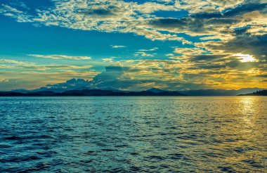 Idyllic Evening view of the Pacific Coast in Muelle Conchal with dramatic clouds. Idyllic sunset landscape. Colorado, Costa Rica. Pura Vida concept, travel to exotic tropical country.