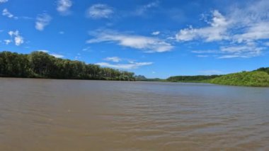Boat moving through the Tempisque River with beautiful landscape of rainforest , POV view from boat in Guanacaste region. Costa Rica