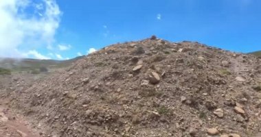 Drive in road to top of the Ethiopian Bale Mountains National Park. Ethiopia wilderness pure nature. Sunny day with blue sky.