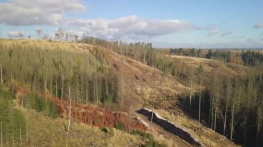 Aerial view of autumn sunrise countryside, traditional fall landscape with rising sun in Central europe. Frozen landscape from bird eye. Czech Republic,Vysocina highland