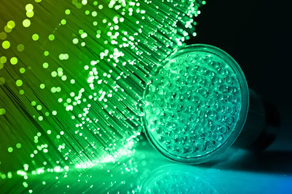 Fiber optics achtergrond met veel licht vlekken — Stockfoto