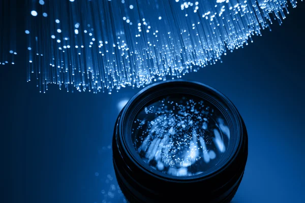 Fiber optics achtergrond met veel licht vlekken — Stockfoto