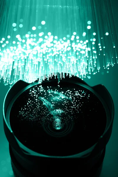 Fiber optics achtergrond met veel licht vlekken — Stockfoto