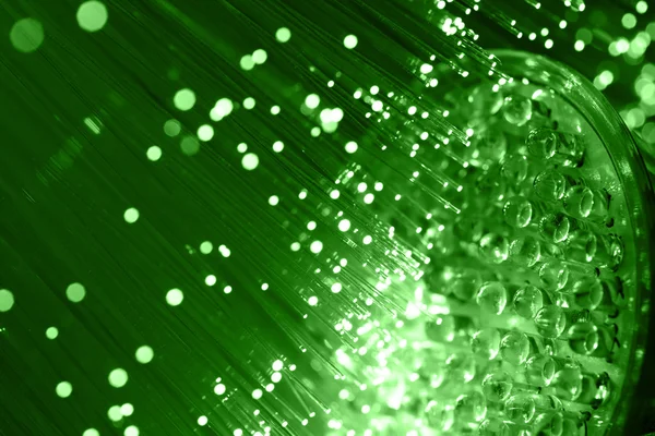 Fiber optics achtergrond met veel licht vlekken — Stockfoto