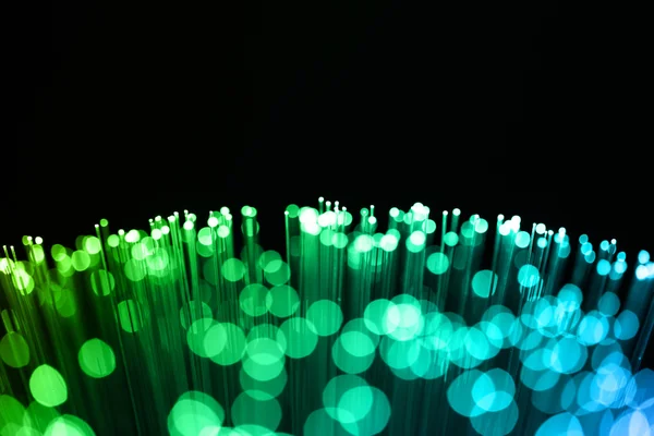 Fiber optics achtergrond met veel licht vlekken — Stockfoto