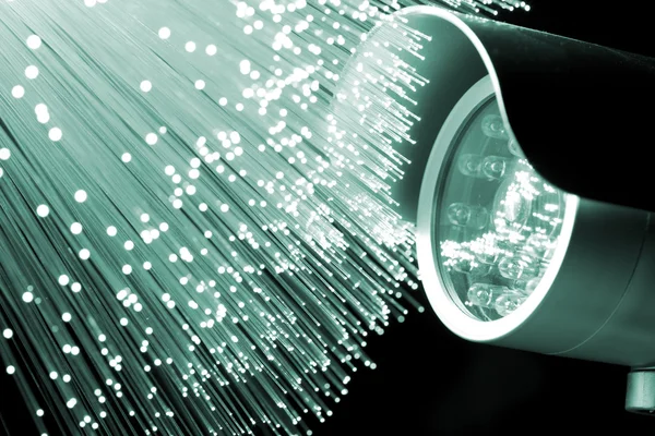 güvenlik kamerası ve fiber optik arka plan