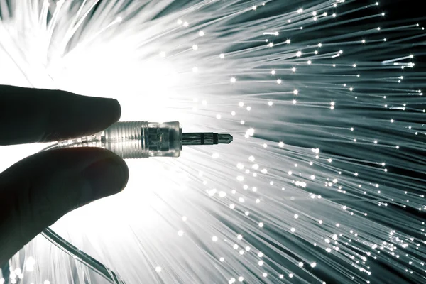 Hand with audio cable — Stock Photo, Image