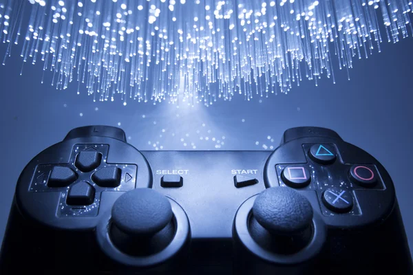 Controlador de jogo e luz azul — Fotografia de Stock