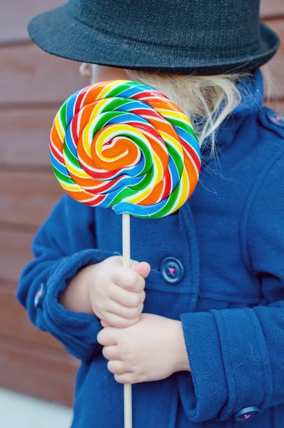 Girl and huge lollypop — Stock Photo, Image