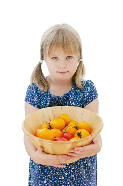 Girl with a bowl of tomatoes — Stock Photo, Image