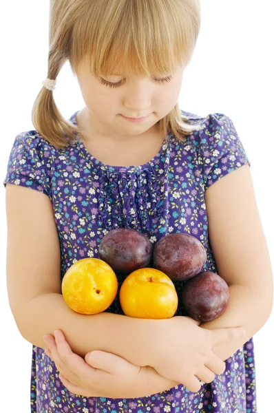 Girl holding plums on the isolated background — Stock Photo, Image