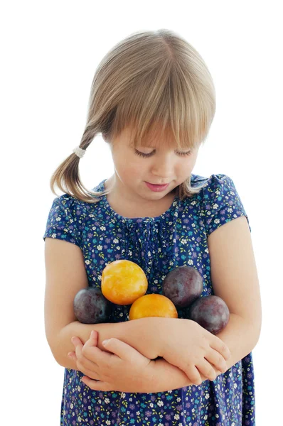 Girl with plums on the white background — Stock Photo, Image