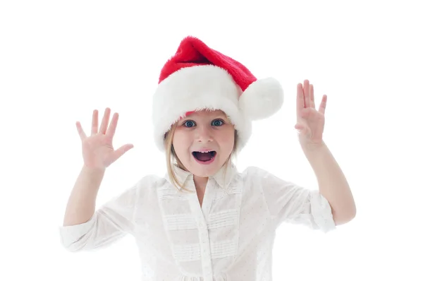 Beyaz arka plan üzerinde santa's şapkalı heyecanlı kız