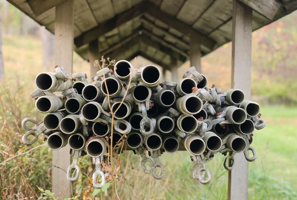Pipes under the wooden roof — Stock Photo, Image