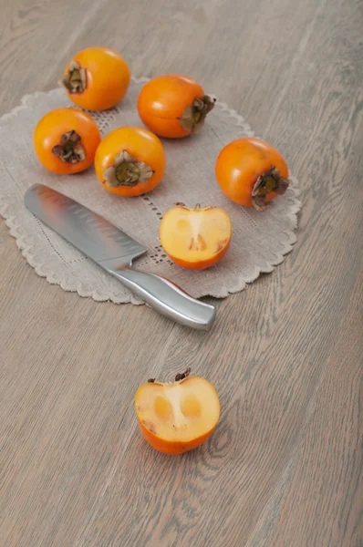 Cut in half kaki fruit — Stock Photo, Image