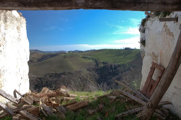 Destroyed house and fields — Stock Photo, Image