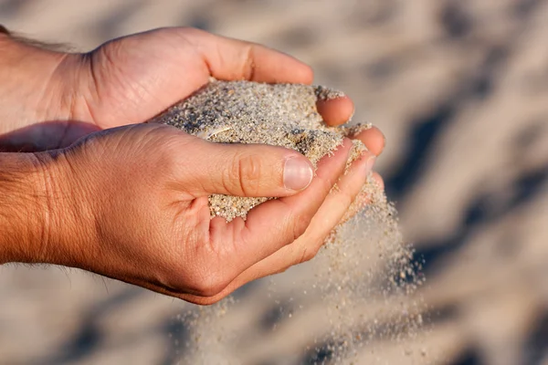 Hands with sand Stock Image