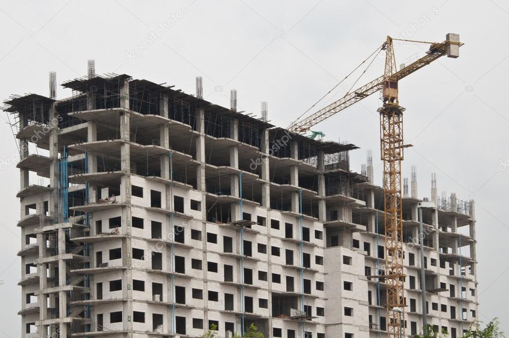 Unfinished building Under contruction as grey background
