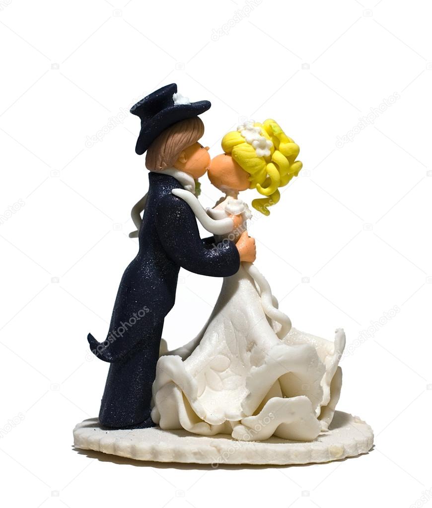 Figurine of bride and groom for wedding cake on white background