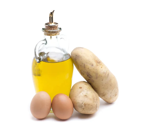 Olijfolie, aardappelen en eieren Stockafbeelding