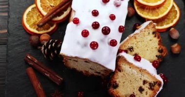 Christmas cake with cranberries. Christmas homebaked. Christmas stollen and Christmas decorations. Super slow motion.