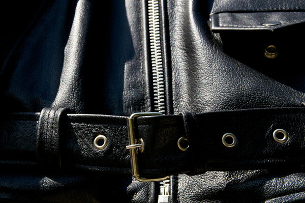 black leather biker jacket belt zipper and pocket