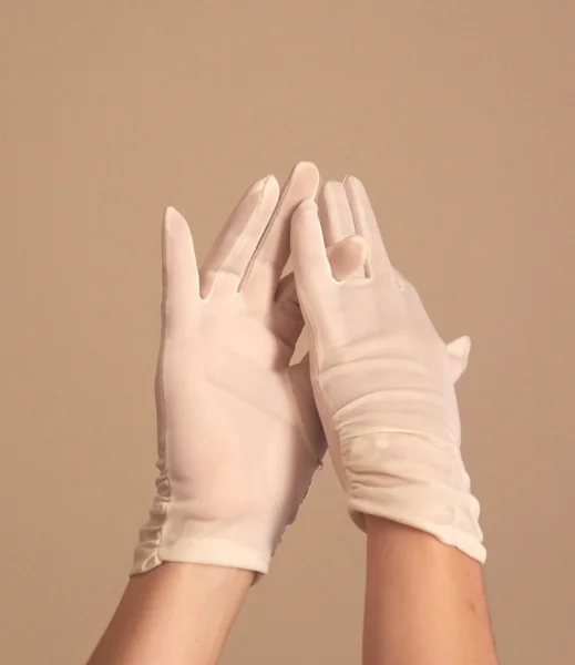 Woman modeling and adjusting vintage formal white gloves — Stock Photo, Image