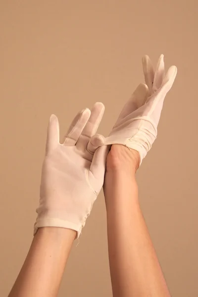 Woman putting on vintage white gloves — Stock Photo, Image