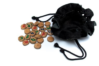 hand carved and painted wooden oak runes with open bag clipart