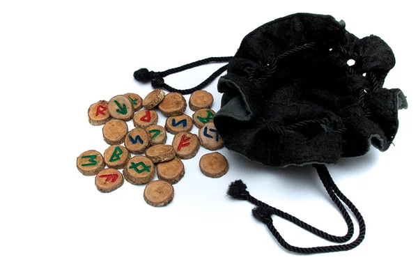 Hand carved and painted wooden oak runes with open bag — Stock Photo, Image