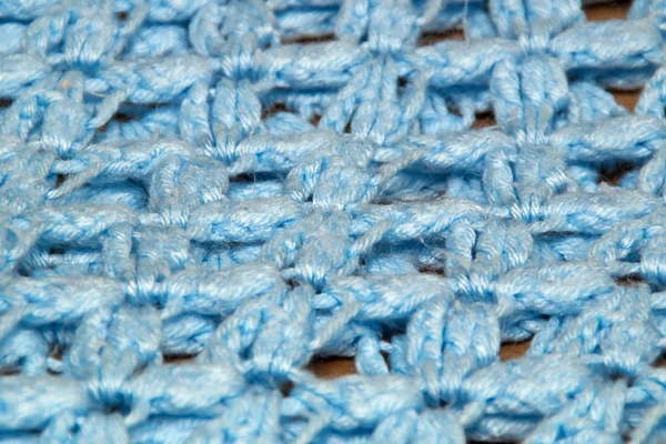 Vinklad detaljvy av blå virkade afghanska filt — Stockfoto