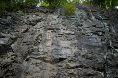 Looking up at sheer cliff from below at whiteface mountain in Wilmington new york in the adirondacks.
