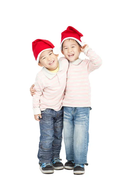 Gelukkige Aziatische jonge geitjes met Kerstmis hoeden — Stockfoto