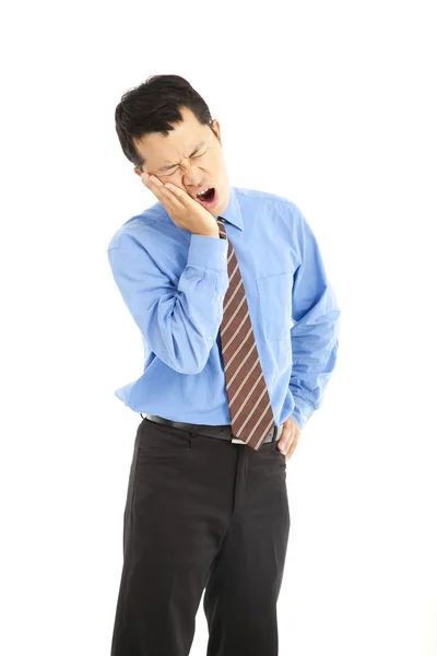 Young businessman in agony with a toothache over white background — Stock Photo, Image