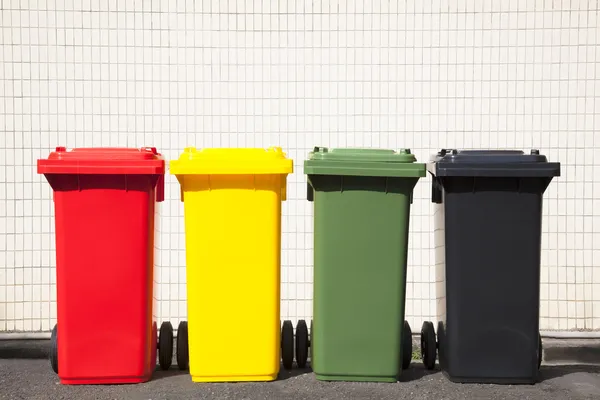 Four colors recycle bins on the street — Stock Photo, Image