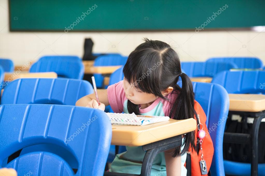 School girl study alone in the classroom — Stock Photo © tomwang 15087369