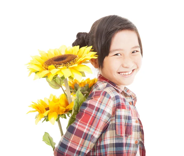 Smiling little girl with sunflower — Stock Photo, Image