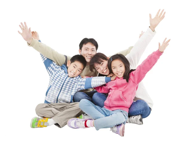 Família feliz sentado e levantando a mão — Fotografia de Stock