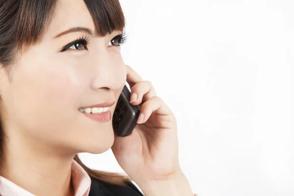 Closeup of young businesswoman talking on the phone — Stock Photo, Image