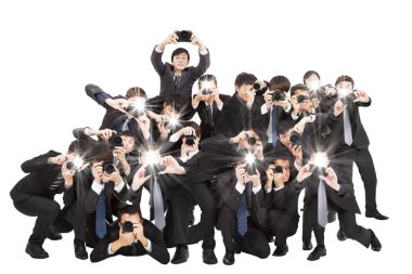 many photographers holding camera pointing to you and isolated o clipart