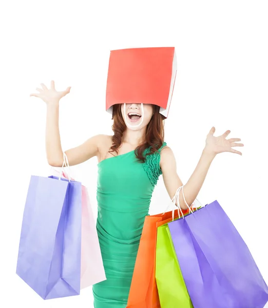 Excited young woman with shopping bag on the head Royalty Free Stock Photos