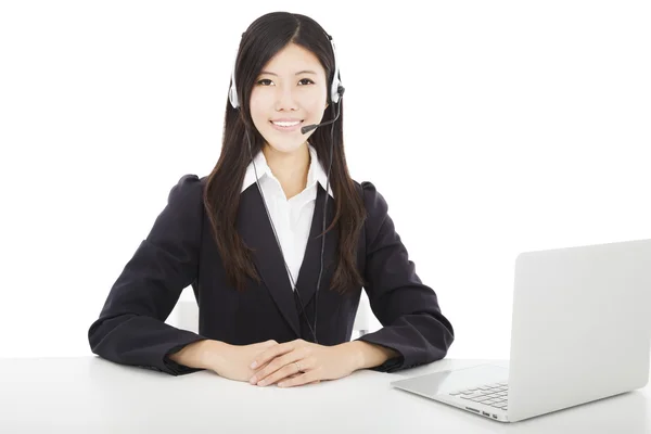 Young smiling businesswoman with headset and laptop — Stock Photo, Image