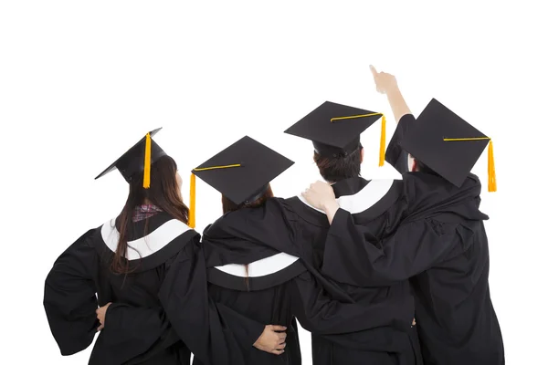 Dört yüksek lisans öğrencileri ve işaret yukarıya bakıyor — Stok fotoğraf