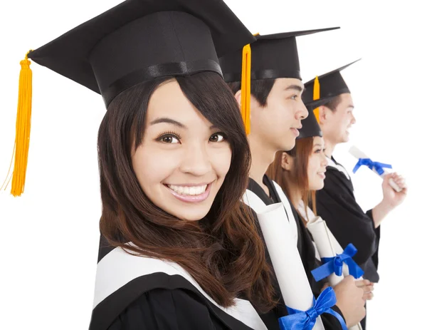 Felici studenti laureati e isolati su sfondo bianco — Foto Stock