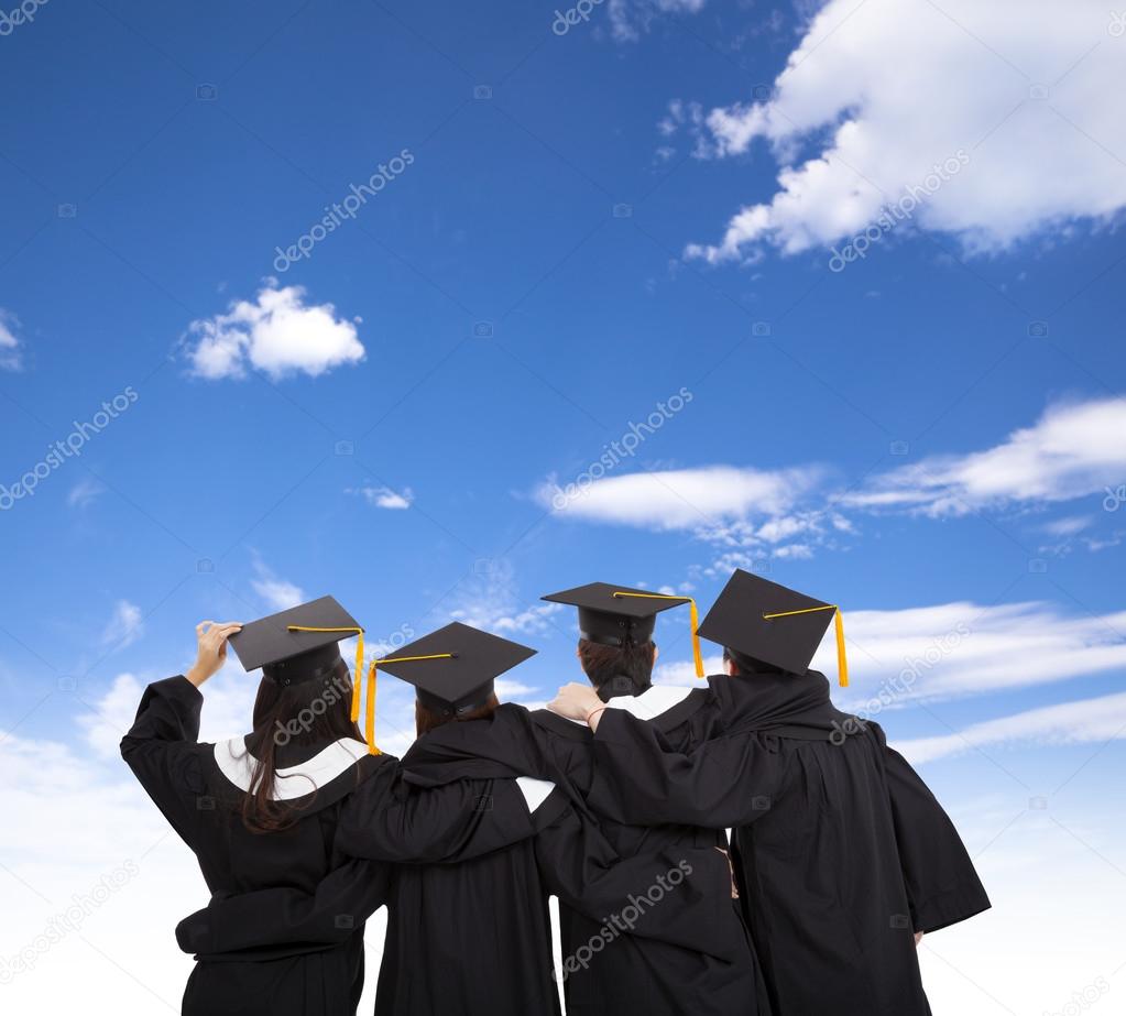 four graduate students looking at sky