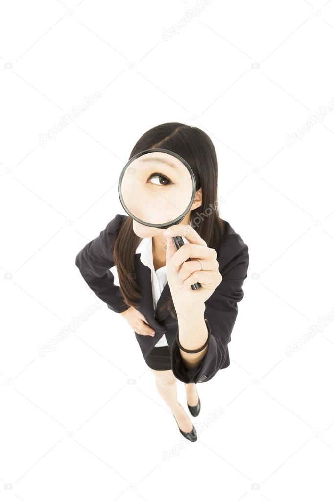 Young business Woman holding Magnifying Glass