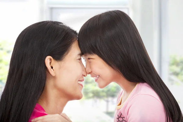 Happy little girl looking with her mother — Stock Photo, Image