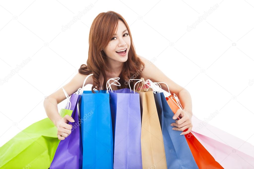 beautiful young woman holding shopping bags