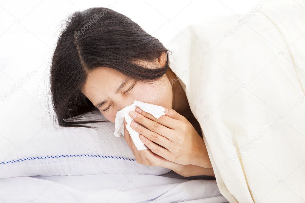young Woman with sick and laying in bed